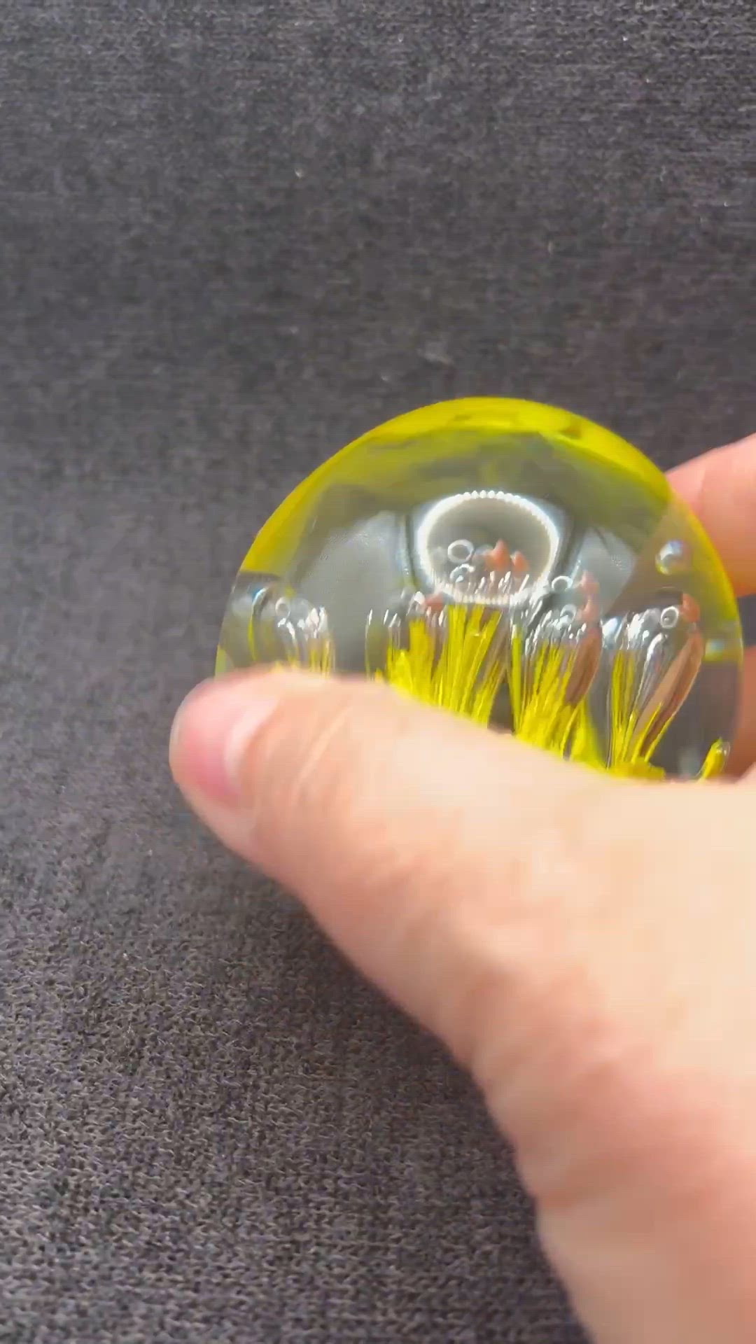 Art Glass sphere paperweight - yellow base with controlled bubble design