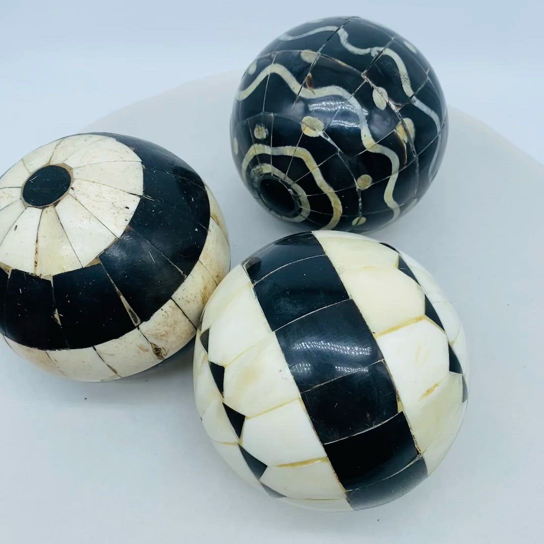 #4001 Antique set of three carpet bowls in black and white